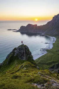 Scandinavian Coastal View Drucke: Sunset, hiker on rocks, cliffs