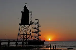 Backlit Lighthouse Photo Drucke: Sunset, lighthouse Obereversand