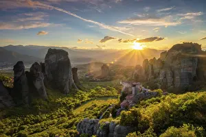 Sunset In Greece Drucke: Sunset over monastery of Rousanou and Monastery of St
