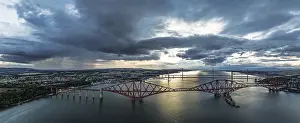 UNESCO World Heritage Site Panorama Drucke: Sunset Panorama of Rain clouds over Forth Bridge from a drone