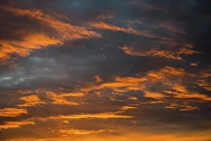 Dramatic Evening Sky Drucke: Sunset with red illuminated clouds, Germany