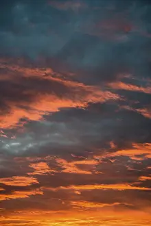 Deserted Evening Sky Germany Drucke: Sunset with red illuminated clouds, Germany
