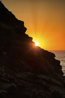 Atlantic Coast Sunset Drucke: Sunset behind rocks, Atlantic coast