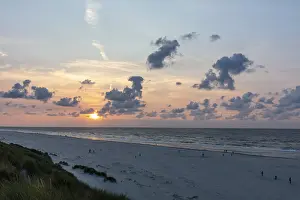 Deserted Dutch Coast Drucke: Sunset on a sandy beach with dunes