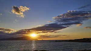 Sunset Over The Sea Drucke: Sunset over the sea with clouds