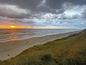Evening Sky Over The Sea Drucke: Sunset over the sea under a dramatic