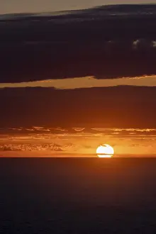 Cloudy Evening Sky Europe Drucke: Sunset over the sea, with dramatic clouds