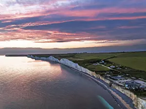 English Channel Coastline Drucke: Sunset over Seven Sisters Cliffs from a drone