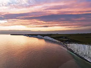 English Channel Coastline Drucke: Sunset over Seven Sisters Cliffs from a drone