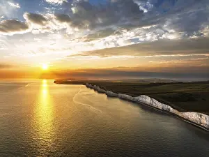 English Channel Coastline Drucke: Sunset over Seven Sisters Cliffs from a drone
