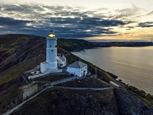 Elevated View Of Devon Coastline Drucke: Sunset over Start Point Lighthouse from a drone