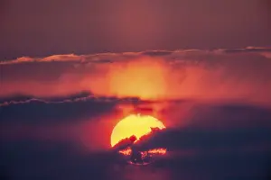 Overcast Evening Atmosphere Drucke: Sunset, sun behind clouds