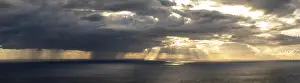Madeira Sunset Drucke: Sunset, sun rays over sea, dark rain cloud