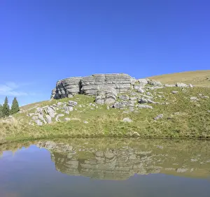 European Karst Landscape Photography Drucke: Surface karst rock formations are reflected in a pond