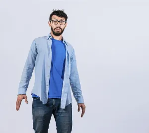 Hispanic Ethnicity Man Drucke: Surprised bearded man looking into the camera isolated