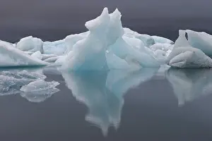 South Iceland Landscape Drucke: Symmetrical ice structures reflected in the calm water