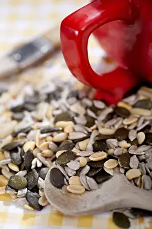 Single Person Baking Drucke: A table with several nuts and kernels