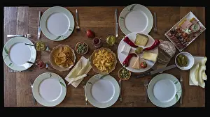 Uninhabited Dinner Table Drucke: Table set with cheese, sausage