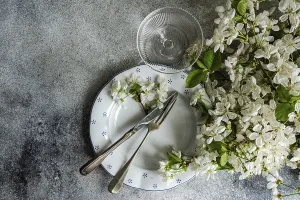 Vintage Home Decor Inspiration Drucke: A table setting features vintage cutlery on a patterned plate