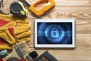 Tablet Pc Security Concept Drucke: Tablet pc with security concept on screen and industrial tools around