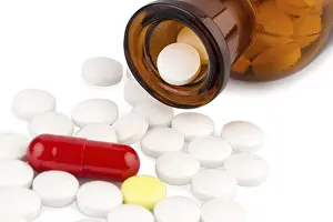 Medical Care Conceptual Image Drucke: Many tablets with a glass container