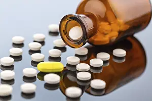 Symbolic Pill Image Drucke: Many tablets with a glass container