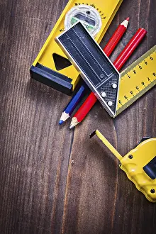 Heavy Duty Equipment Drucke: Tapeline square ruler pencils level with small copyspace construction concept
