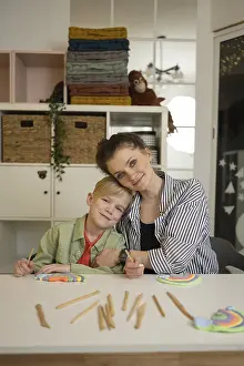 Teacher Student Relationship Drucke: Teacher and student sitting at a table