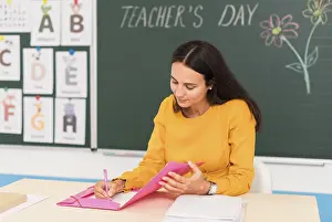 Teacher Student Relationship Drucke: Teacher taking notes class