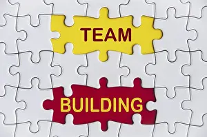 Deserted Office Space Photo Drucke: Team building text on missing jigsaw