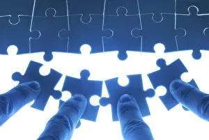 Successful Collaboration Drucke: Team work on solving puzzle problem