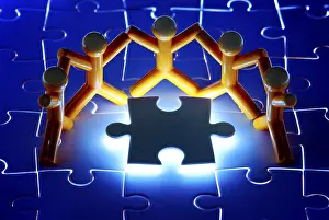 Teamwork Concept Drucke: Team work on solving puzzle problem