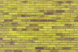 Brick Wall Design Drucke: Texture of an old yellow brick wall