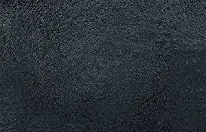 Empty Uninhabited Landscape Photo Drucke: A textured black abstract surface with a rough appearance