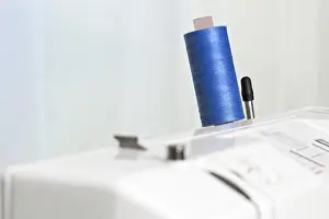 Sewing Machine Details Drucke: Thread on a sewing machine, small DOF
