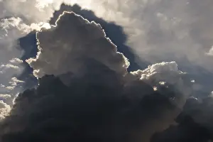 Cumulus Humilis Clouds Drucke: Thunderclouds, Altocumulus, sun behind grey clouds