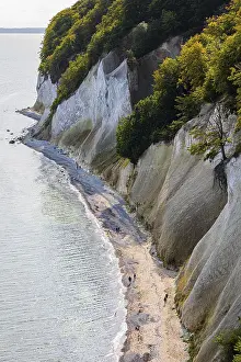 Central European Nature Reserves Drucke: Tourists on the beach below the chalk cliffs