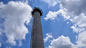 Central Europe Landmark Drucke: Tower under bright blue sky with scattered clouds