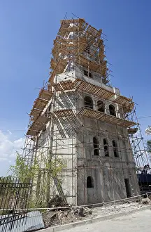 Deserted Construction Site Europe Drucke: Tower building under construction over blue sky background