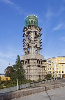Exterior View Of A Sacral Building Drucke: Tower monastery under construction over blue sky background in Samara