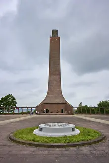 Baltic Sea Seaside Resort Drucke: Towering brick monument under a cloudy sky