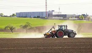 Baden Wurttemberg Farmland Drucke: Tractor with seed drill in the field in spring