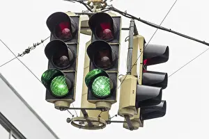 Deserted Street Scene Drucke: A traffic light with a green light