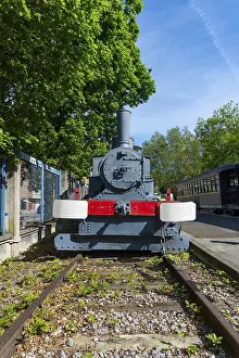 Blue Clear Sky Drucke: A train is sitting on the tracks in a yard