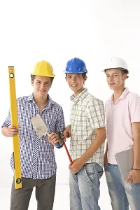 Hard Hat Protection Drucke: Three trainees with helmets, pliers