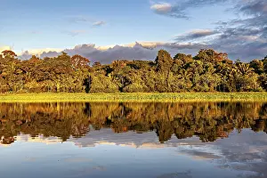 Evening Water Reflections Drucke: Tranquil scene of a river with trees and cloud reflections