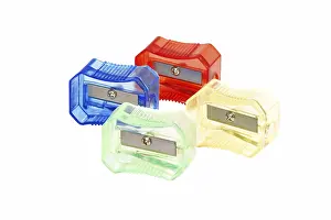Colourful Office Supplies Drucke: Four transparent colored plastic pencil sharpener