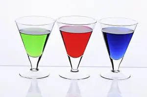 Colourful Beverage Drucke: Three transparent glasses with multi-coloured drinks