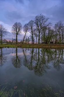 Northern Germany Nature Scenery Drucke: Trees reflected in a pond, evening mood
