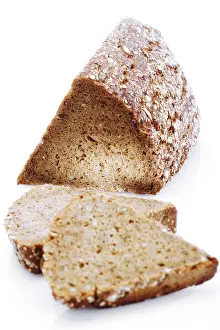 Studio Shot Bread Drucke: Triangular loaf and slices of wholegrain bread